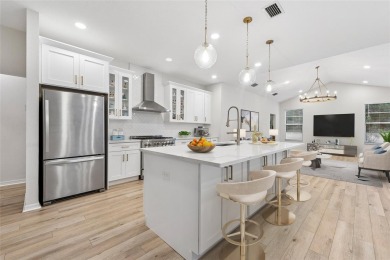 Welcome to your dream home at 9402 Woodbay Drive, where modern on Westchase Golf Club in Florida - for sale on GolfHomes.com, golf home, golf lot