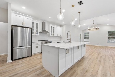 Welcome to your dream home at 9402 Woodbay Drive, where modern on Westchase Golf Club in Florida - for sale on GolfHomes.com, golf home, golf lot