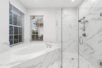 Welcome to your dream home at 9402 Woodbay Drive, where modern on Westchase Golf Club in Florida - for sale on GolfHomes.com, golf home, golf lot