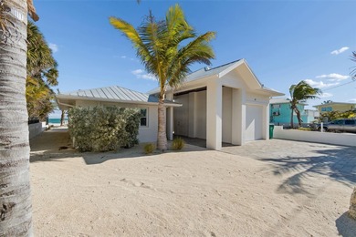 Fully updated, beach front stunner! Situated on the highly on Key Royale Club in Florida - for sale on GolfHomes.com, golf home, golf lot