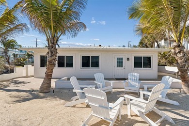 Fully updated, beach front stunner! Situated on the highly on Key Royale Club in Florida - for sale on GolfHomes.com, golf home, golf lot
