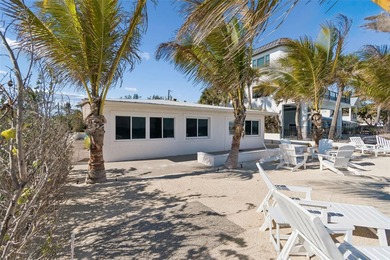 Fully updated, beach front stunner! Situated on the highly on Key Royale Club in Florida - for sale on GolfHomes.com, golf home, golf lot