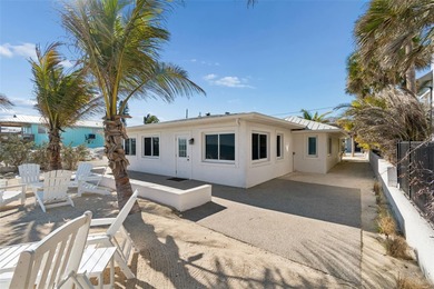 Fully updated, beach front stunner! Situated on the highly on Key Royale Club in Florida - for sale on GolfHomes.com, golf home, golf lot
