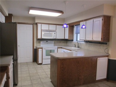 Upon entering this well maintained home you are immediately on Holiday Island Golf Course in Arkansas - for sale on GolfHomes.com, golf home, golf lot