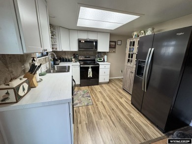 Welcome to this extensively renovated one-level 3-bedroom on Riverton Country Club in Wyoming - for sale on GolfHomes.com, golf home, golf lot