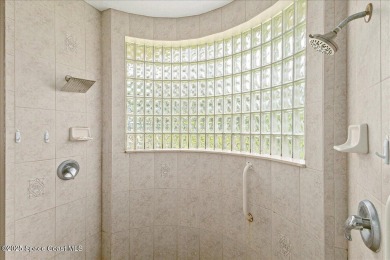 Located in Baytree, Florida, this 3,275-square-foot home sits on on Baytree National Golf Links in Florida - for sale on GolfHomes.com, golf home, golf lot
