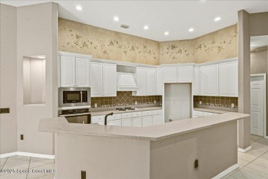 Located in Baytree, Florida, this 3,275-square-foot home sits on on Baytree National Golf Links in Florida - for sale on GolfHomes.com, golf home, golf lot