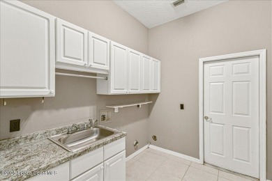 Located in Baytree, Florida, this 3,275-square-foot home sits on on Baytree National Golf Links in Florida - for sale on GolfHomes.com, golf home, golf lot