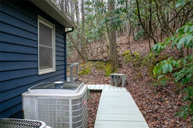 This beautifully updated 4BR, 3BA home in the sought-after on Connestee Falls Golf Club in North Carolina - for sale on GolfHomes.com, golf home, golf lot