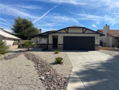 Welcome to this inviting 3-bedroom, 2-bathroom home in a on Spring Valley Lake Country Club in California - for sale on GolfHomes.com, golf home, golf lot