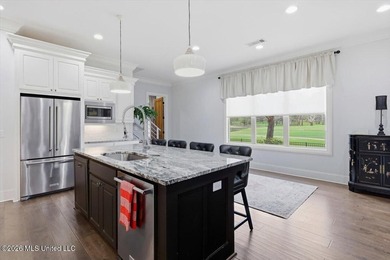 Golf course and lake views come together at 387 Caroline Blvd in on Lake Caroline Golf Club in Mississippi - for sale on GolfHomes.com, golf home, golf lot