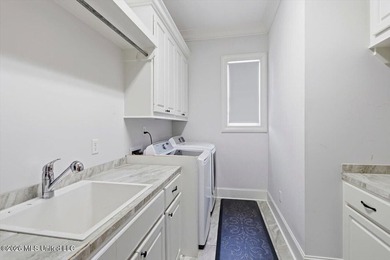 Golf course and lake views come together at 387 Caroline Blvd in on Lake Caroline Golf Club in Mississippi - for sale on GolfHomes.com, golf home, golf lot