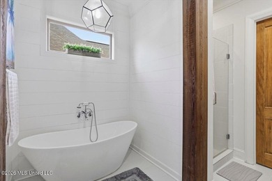 Golf course and lake views come together at 387 Caroline Blvd in on Lake Caroline Golf Club in Mississippi - for sale on GolfHomes.com, golf home, golf lot