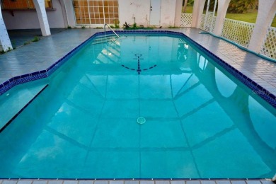 What a find in this neighborhood of picturesque homes!  Tucked on Deep Creek Golf Club in Florida - for sale on GolfHomes.com, golf home, golf lot