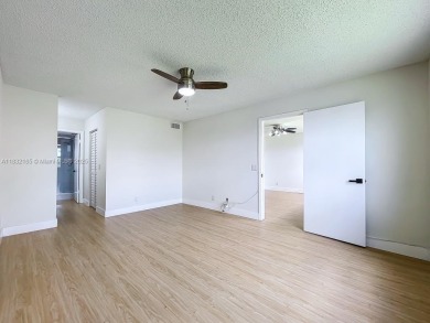 This unit is a RENOVATED & UPDATED -1370 SF 2BR/2BA unit in the on Sunrise Lakes Phase IV Golf Course in Florida - for sale on GolfHomes.com, golf home, golf lot