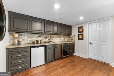 Nestled on over half an acre in the coveted Atlanta Country Club on Atlanta Country Club in Georgia - for sale on GolfHomes.com, golf home, golf lot