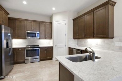 This beautiful Arbor II Model Townhome built in 2022 is located on Plantation Bay Golf and Country Club in Florida - for sale on GolfHomes.com, golf home, golf lot