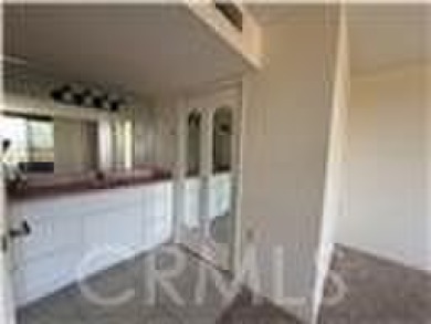 This is a popular east-facing C Unit in the Towers on the 10th on Leisure Village Par 3 Golf Course in California - for sale on GolfHomes.com, golf home, golf lot