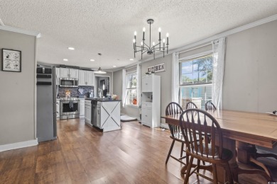 Nestled in the warm embrace of Murrells Inlet's scenic coastal on Indian Wells Golf Course in South Carolina - for sale on GolfHomes.com, golf home, golf lot