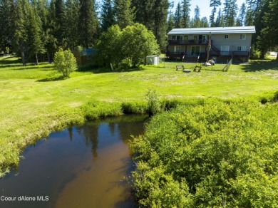 Creekside living in the heart of Priest Lake. 100ft of gorgeous on Priest Lake Golf and Tennis Club in Idaho - for sale on GolfHomes.com, golf home, golf lot