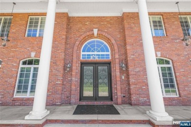 Set on a beautifully landscaped acre with a stunning circular on Old Tappan Golf Course in New Jersey - for sale on GolfHomes.com, golf home, golf lot