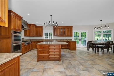 Set on a beautifully landscaped acre with a stunning circular on Old Tappan Golf Course in New Jersey - for sale on GolfHomes.com, golf home, golf lot