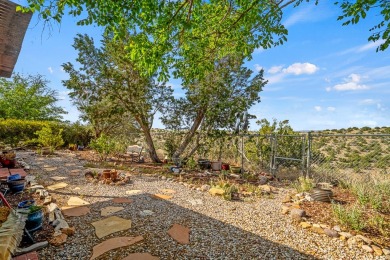 Step through a charming walled courtyard and enter a world of on Pueblo de Cochiti Golf Course in New Mexico - for sale on GolfHomes.com, golf home, golf lot