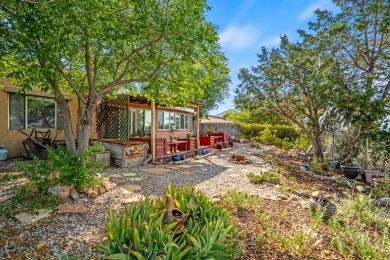 Step through a charming walled courtyard and enter a world of on Pueblo de Cochiti Golf Course in New Mexico - for sale on GolfHomes.com, golf home, golf lot