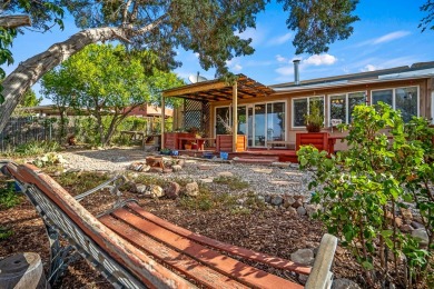 Step through a charming walled courtyard and enter a world of on Pueblo de Cochiti Golf Course in New Mexico - for sale on GolfHomes.com, golf home, golf lot