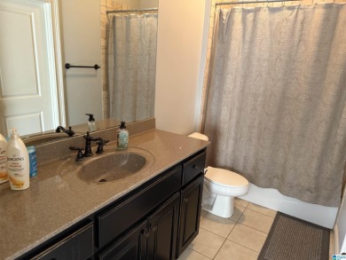 This custom home welcomes you with double front doors, an on Greystone Golf and Country Club-Founders Course in Alabama - for sale on GolfHomes.com, golf home, golf lot