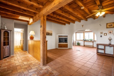 Step through a charming walled courtyard and enter a world of on Pueblo de Cochiti Golf Course in New Mexico - for sale on GolfHomes.com, golf home, golf lot