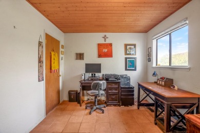 Step through a charming walled courtyard and enter a world of on Pueblo de Cochiti Golf Course in New Mexico - for sale on GolfHomes.com, golf home, golf lot