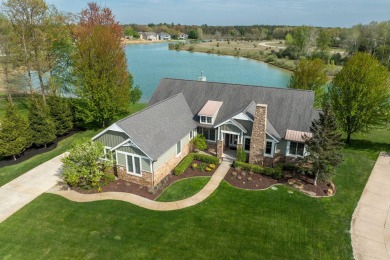 Experience refined waterfront living at its finest with this on Tullymore Golf Club in Michigan - for sale on GolfHomes.com, golf home, golf lot
