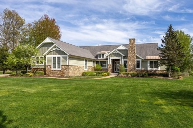 Experience refined waterfront living at its finest with this on Tullymore Golf Club in Michigan - for sale on GolfHomes.com, golf home, golf lot