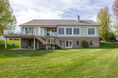 Experience refined waterfront living at its finest with this on Tullymore Golf Club in Michigan - for sale on GolfHomes.com, golf home, golf lot