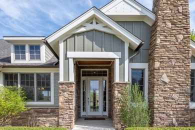 Experience refined waterfront living at its finest with this on Tullymore Golf Club in Michigan - for sale on GolfHomes.com, golf home, golf lot