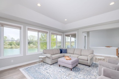 Experience refined waterfront living at its finest with this on Tullymore Golf Club in Michigan - for sale on GolfHomes.com, golf home, golf lot