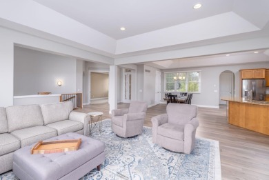 Experience refined waterfront living at its finest with this on Tullymore Golf Club in Michigan - for sale on GolfHomes.com, golf home, golf lot