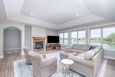Experience refined waterfront living at its finest with this on Tullymore Golf Club in Michigan - for sale on GolfHomes.com, golf home, golf lot