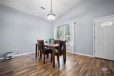 Welcome home to this precious cottage tucked away on a quiet on Lake Forest Yacht and Country Club in Alabama - for sale on GolfHomes.com, golf home, golf lot