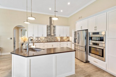 Tucked behind the private gates of the prestigious Emerald Bay on Emerald Bay Golf Club in Florida - for sale on GolfHomes.com, golf home, golf lot