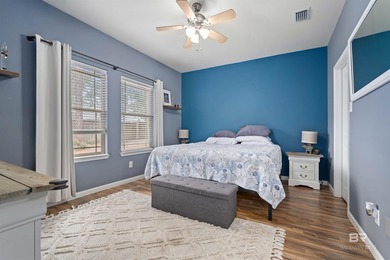 Welcome home to this precious cottage tucked away on a quiet on Lake Forest Yacht and Country Club in Alabama - for sale on GolfHomes.com, golf home, golf lot