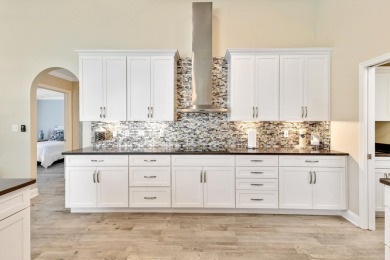 Tucked behind the private gates of the prestigious Emerald Bay on Emerald Bay Golf Club in Florida - for sale on GolfHomes.com, golf home, golf lot