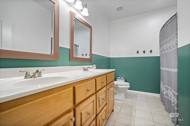 Welcome home to this precious cottage tucked away on a quiet on Lake Forest Yacht and Country Club in Alabama - for sale on GolfHomes.com, golf home, golf lot