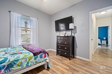 Welcome home to this precious cottage tucked away on a quiet on Lake Forest Yacht and Country Club in Alabama - for sale on GolfHomes.com, golf home, golf lot