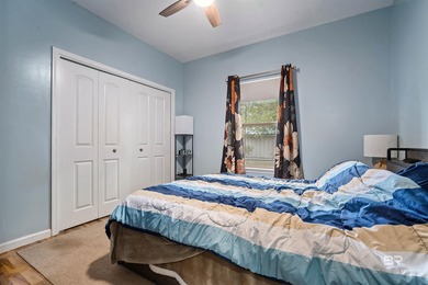 Welcome home to this precious cottage tucked away on a quiet on Lake Forest Yacht and Country Club in Alabama - for sale on GolfHomes.com, golf home, golf lot