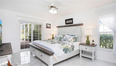 Experience long, unobstructed lake views and relaxed living just on The Glades Golf and Country Club in Florida - for sale on GolfHomes.com, golf home, golf lot