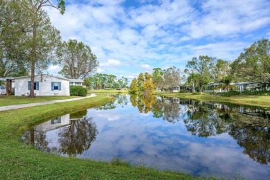 Welcome to your luxurious waterfront oasis in the prestigious on Pine Lakes Country Club in Florida - for sale on GolfHomes.com, golf home, golf lot