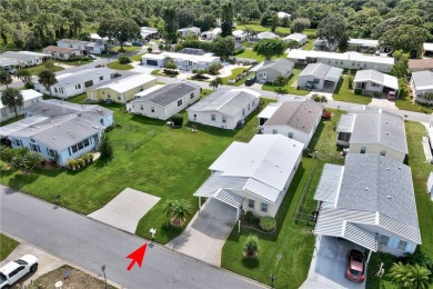 RARE OPPORTUNITY to own this gently used home on TWO LOTS on Barefoot Bay Golf Course in Florida - for sale on GolfHomes.com, golf home, golf lot