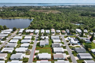 RARE OPPORTUNITY to own this gently used home on TWO LOTS on Barefoot Bay Golf Course in Florida - for sale on GolfHomes.com, golf home, golf lot